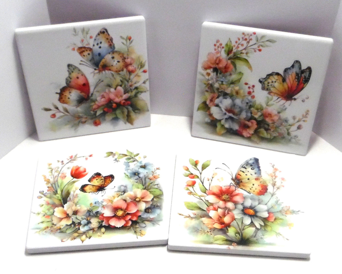 Set of 4 butterfly and floral ceramic coasters with unique watercolor designs in pink coral and blue