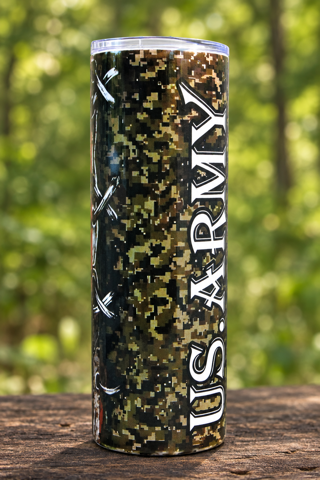 Army camouflage tumbler in a woodland setting
