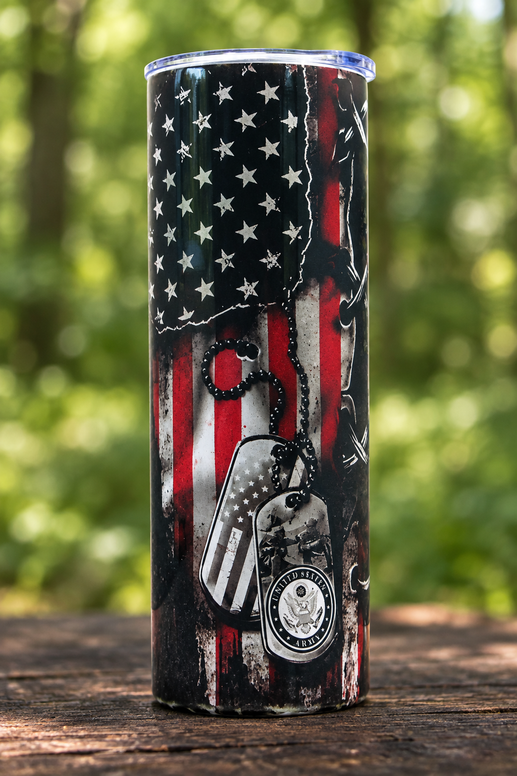 Flag and dog-tag side of the tumbler in a woodland setting