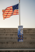 USA 250th Anniversary bald eagle tumbler at a patriotic memorial with American flag
