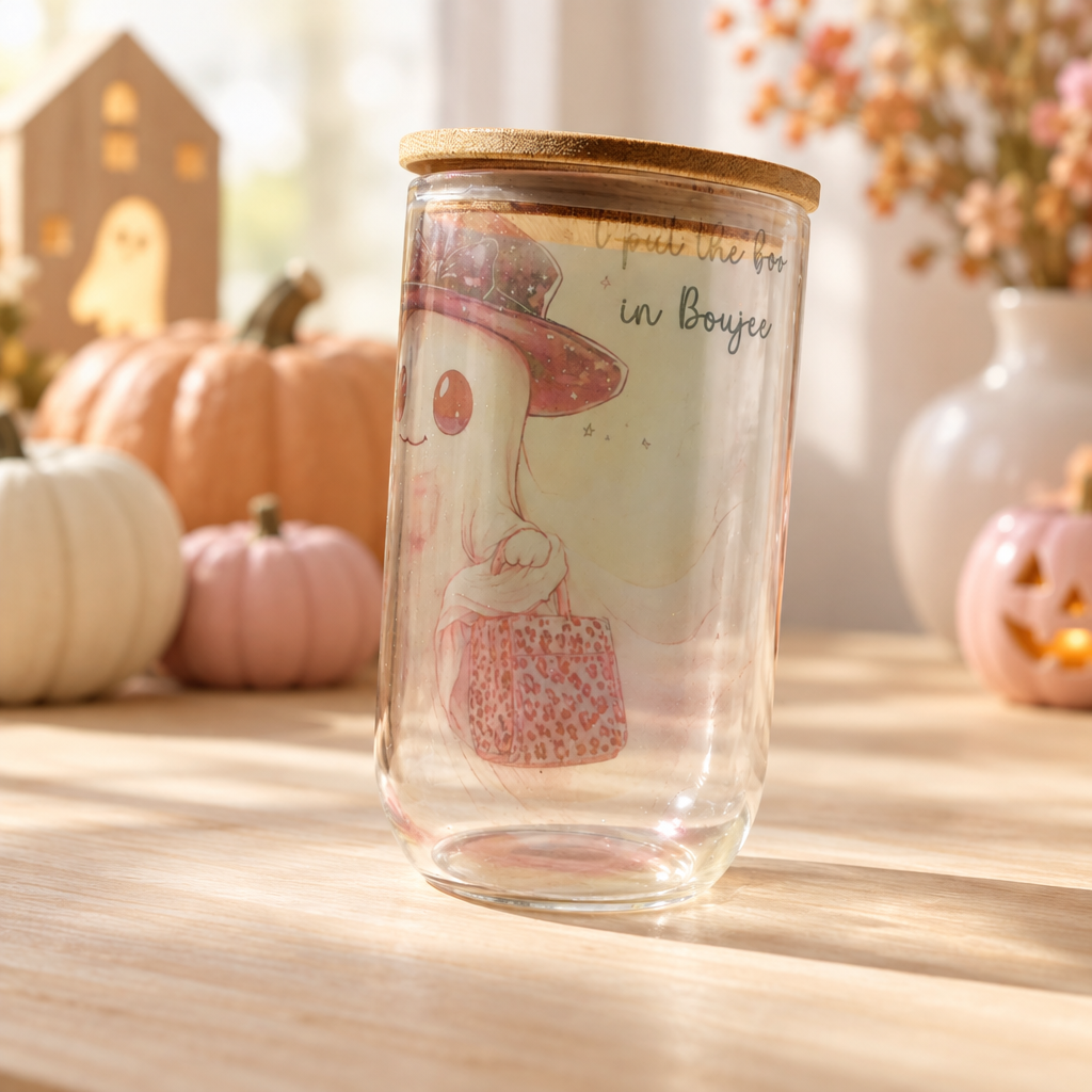 Witch hat ghost clear glass cup side view in a cozy Halloween setting