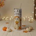 Fall-themed 20 oz skinny tumbler with lid and straw in a playful autumn setting