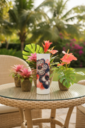 Leopard hibiscus tumbler on a chic outdoor patio with tropical flowers and greenery