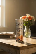Blessed by God Spoiled by My Husband tumbler on a wooden table with warm morning light and flowers
