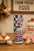 Suspicious Always Has Money for Chickens tumbler on a rustic farmhouse kitchen counter