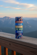Embrace Your Journey tumbler on a wooden overlook with sweeping mountain vista in the background