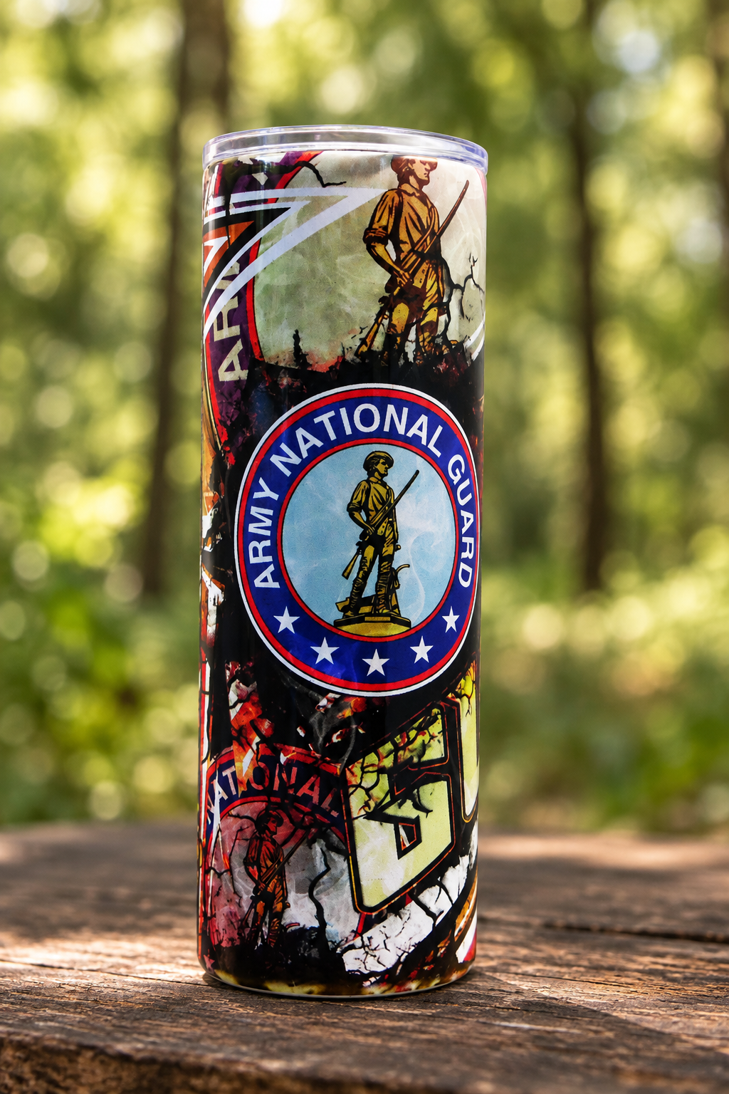 Army National Guard emblem side of 20oz tumbler in a woodland setting